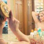 Woman Using Hair Brush